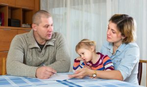 Parents at table with child
